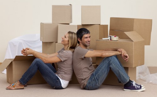 Professional movers handling furniture in a removal van