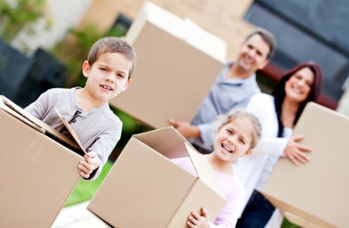 Movers handling office equipment during relocation