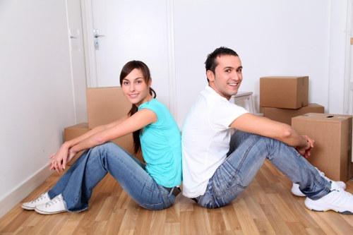 Business relocation team organizing furniture in a new Finnish office