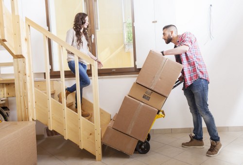 Professional movers loading furniture for a same day move