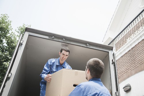 Team member loading items safely into a moving vehicle with care