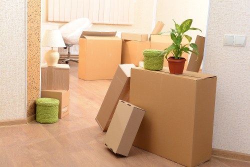 Movers handling sofa and cabinets during furniture transport in Finland