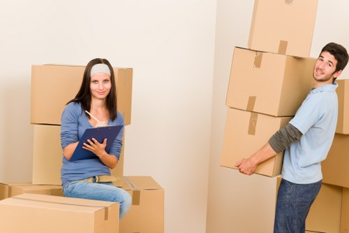 Movers packing household items for relocation in Finland